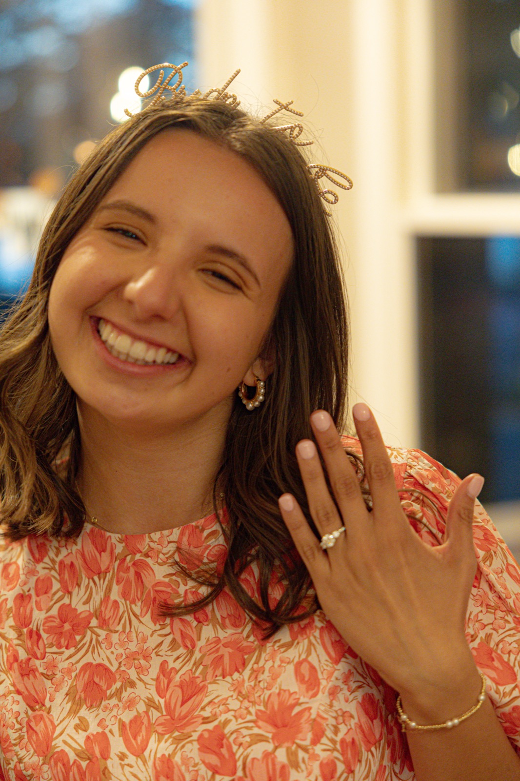 Showing off the engagement ring