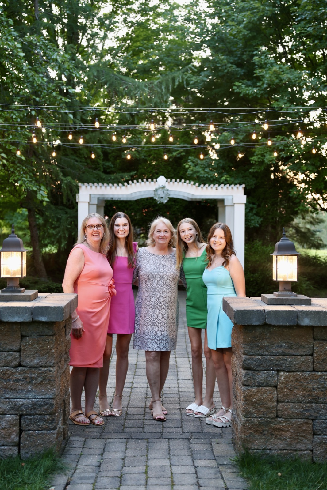 Bridal party under the garden arch