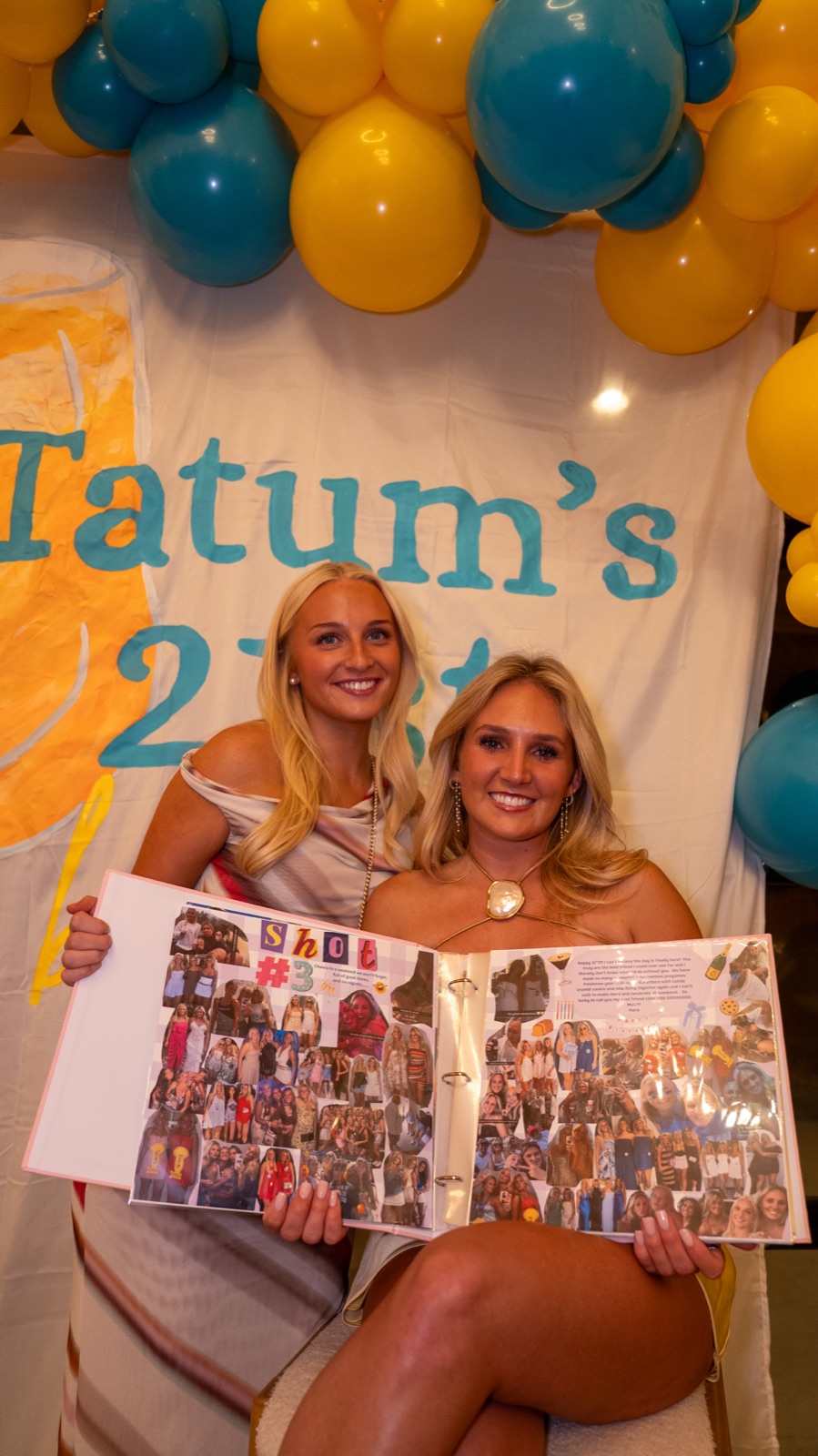 Birthday girl opening her shot book with a friend at her 21st birthday party in Oxford, MS